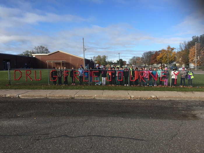 5th grade used red Solo cups to spell Drug Free Journey on the school fence during Red Ribbon Week at AES!
