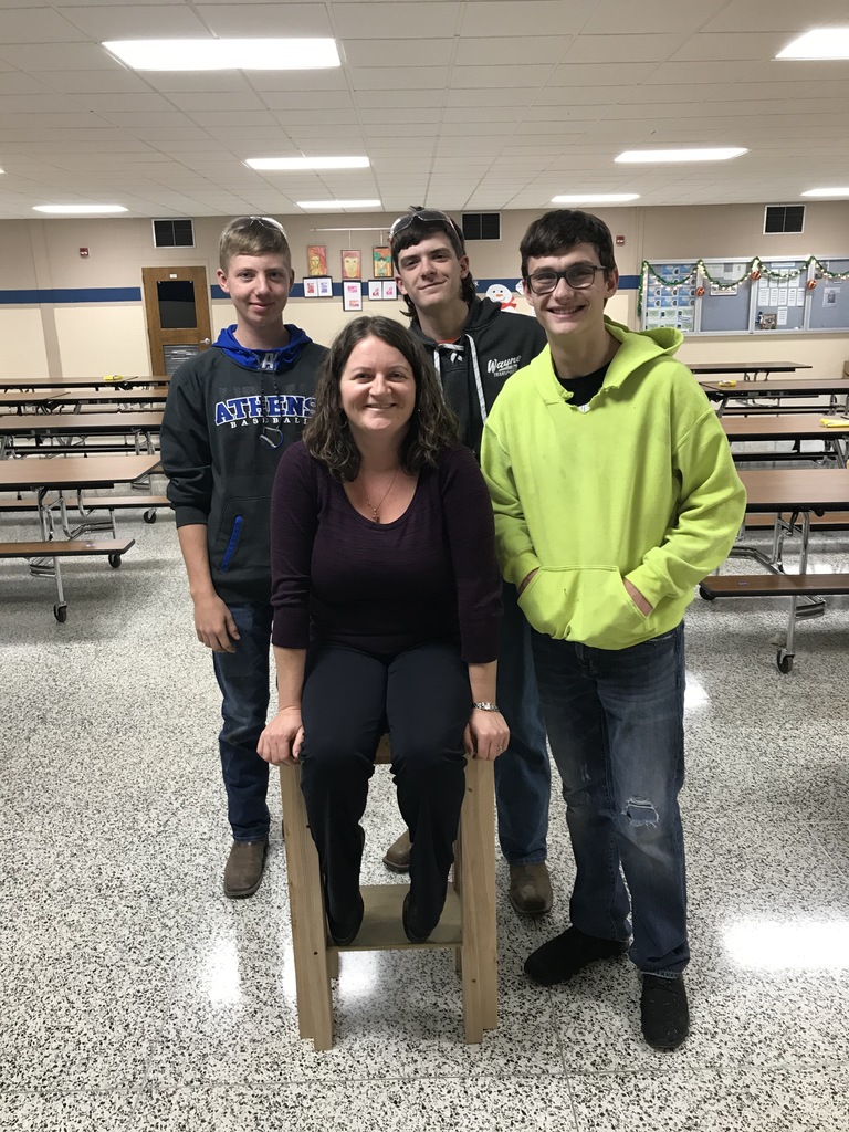 Students showing Mrs. N. the stool they constructed for her.  