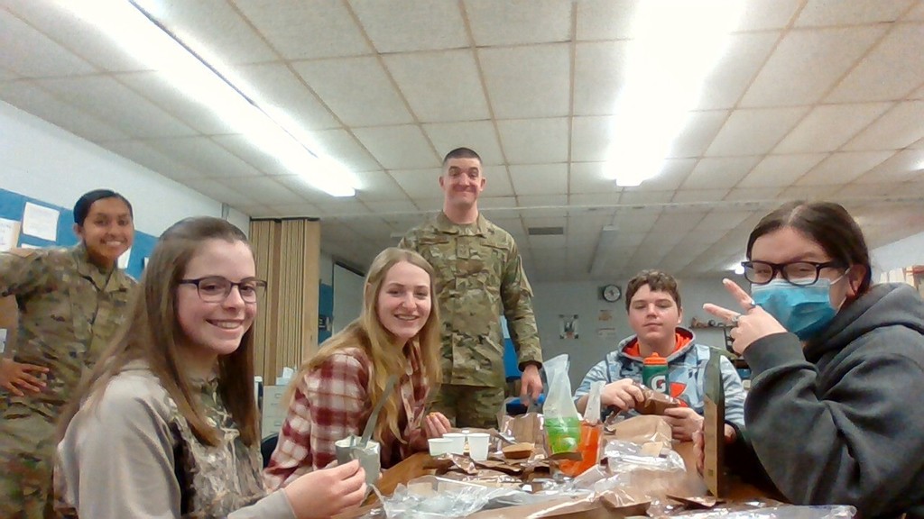 These students are enjoying the MRE activity...as are the smiling recruiters!!